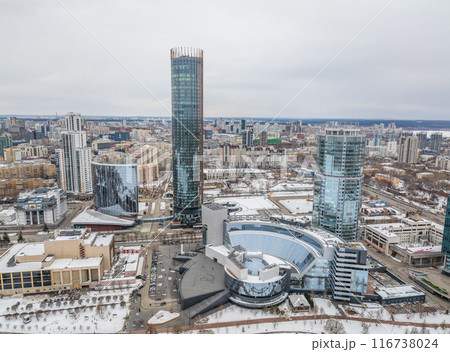 Yekaterinburg city with Buildings of Regional Government and Parliament, Dramatic Theatre, Iset Tower, Yeltsin Center, panoramic view at winter sunset. Yekaterinburg city with Buildings of Regional Government and Parliament, Dramatic Theatre, Iset Tower, Yeltsin Center, panoramic view at winter sunset. 116738024