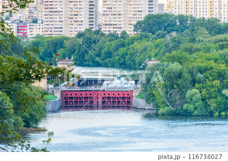 An old gateway on the Moscow river for adjusting the water level in the riverbed. An old gateway on the Moscow river for adjusting the water level in the riverbed. 116738027