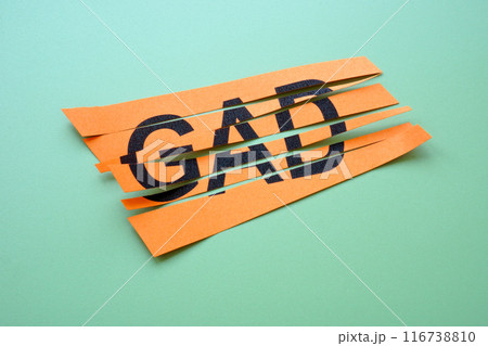 Cut sheet of paper with abbreviation GAD Generalized Anxiety Disorder. 116738810