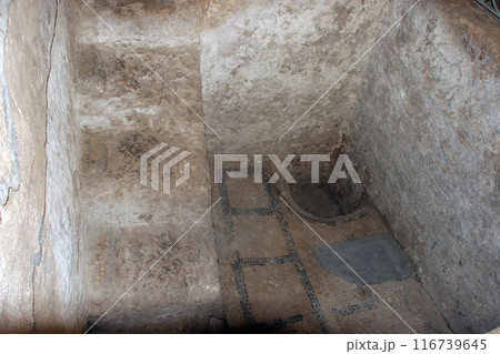 Basin feature alongside an ancient Mosaic in the basement of The Church of St. Joseph in Nazareth, Israel 116739645