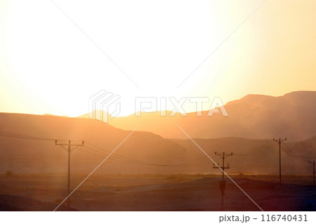 Sunset on the famous road number 90, which crosses Israel from north to south in the Jordan Valley, near the Dead Sea, Israel 116740431