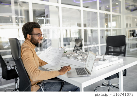 Professional man architect creating exterior designs in the workplace Professional man architect creating exterior designs in the workplace 116741075