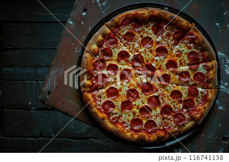 Delicious Pepperoni Pizza with Fresh Arugula Garnish on Wooden Table 116741138