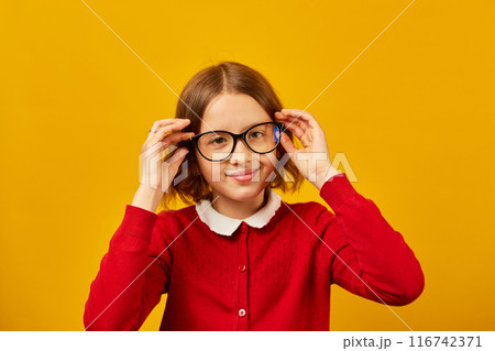 Girl in Red Shirt Wearing Glasses Girl in Red Shirt Wearing Glasses 116742371