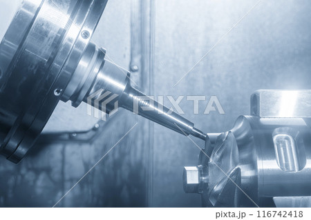The 5-axis CNC milling machine cutting the turbocharger part with solid ball end mill tool. The 5-axis CNC milling machine cutting the turbocharger part with solid ball end mill tool. 116742418