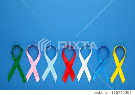 Collection of awareness ribbons on blue. World cancer day 116743365