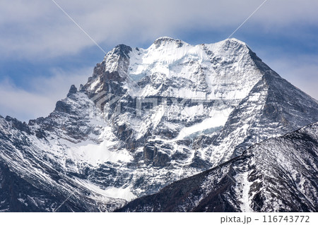 Closeup on Mount Xiannairi peak, one of the four holy mountains in Daocheng Yading Nature Reserve in Sichuan Closeup on Mount Xiannairi peak, one of the four holy mountains in Daocheng Yading Nature Reserve in Sichuan 116743772