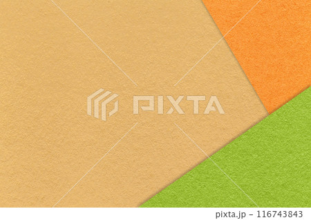 Texture craft yellow paper background with orange and green border. Vintage abstract ocher cardboard. 116743843