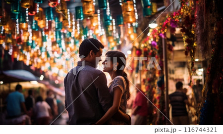 A couple exploring a bustling city together, walking hand in hand through a lively street market 116744321