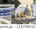 Vibrant Summer Cocktails on Rustic Patio 116744412