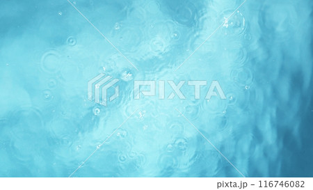 Freeze motion of splashing water surface on light blue background 116746082