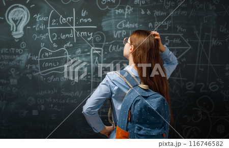 Teenager in class on background of blackboard Teenager in class on background of blackboard 116746582