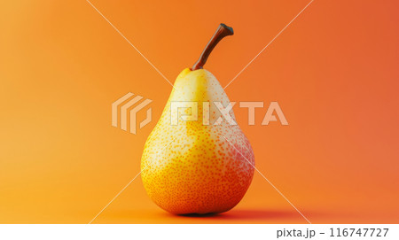Ripe pear with orange gradient background 116747727