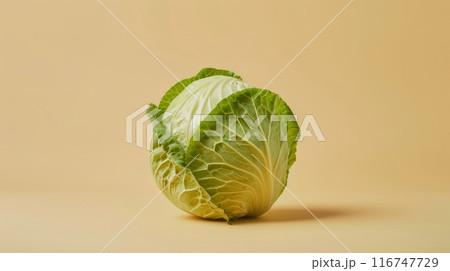 Fresh green cabbage on beige background, studio shot. Healthy eating and organic food concept 116747729