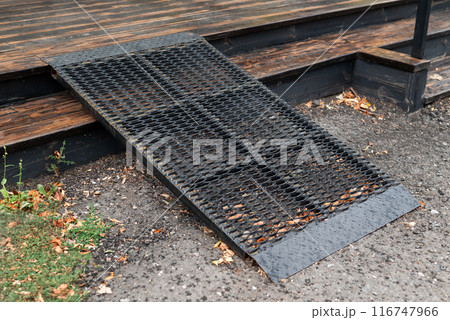 Metal ramp for people with limited mobility to enter the building 116747966