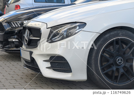 Gaziveren Cyprus 14/03/2024 - white Mercedes and black and white Ford Mustang front and side views 3 116749626