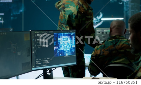 IT software engineer collecting real time data from neural network AI brain, machine learning and data mining algorithms to assist troops with defense missions. Cognitive computing. Camera A. 116750851