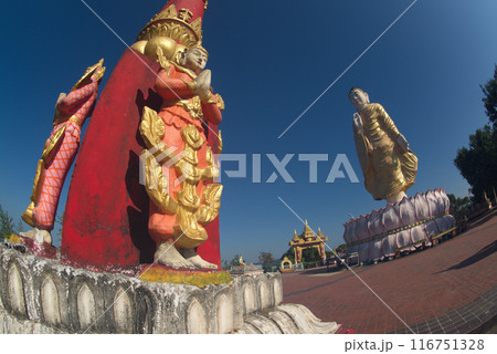 Pillars decorated with angelsTilawkasayambhu standing Buddha statue on top of hill for breathtaking views of the fishing boats and the Ngapali Bay. And it is also a famous viewpoint. Myanmar. 116751328