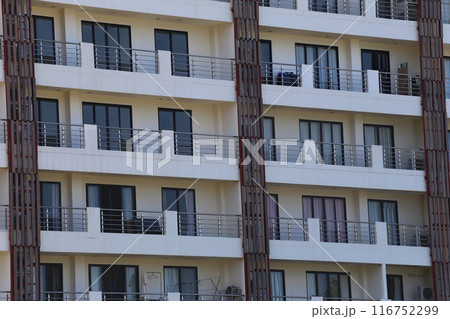 Close up of tall building with a skyscraper background. Close up of tall building with a skyscraper background. 116752299