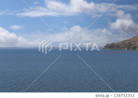 View of Ubonrat Dam during the day with sunlight and clear weather. 116752352