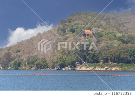 View of Thai temple at Ubonrat Dam during the day with sunlight and clear weather. View of Thai temple at Ubonrat Dam during the day with sunlight and clear weather. 116752358