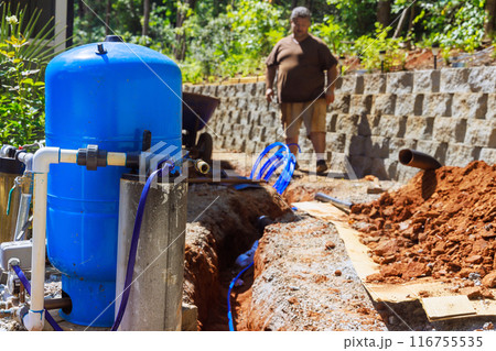 PVC pipe in trench is ready for connection to well water system at home 116755535