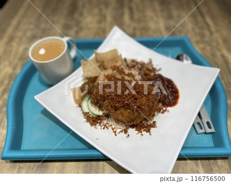 Nasi Lemak with fried chicken, small fish and chili Nasi Lemak with fried chicken, small fish and chili 116756500