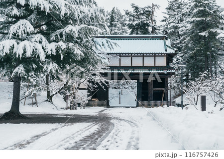 Hirosaki Castle gate or Takaoka Castle entrance with snow in winter, Japanese castle located in Hirosaki city, Aomori Prefecture, Tohoku, Japan. Landmark for tourist attraction. Japan travel Hirosaki Castle gate or Takaoka Castle entrance with snow in winter, Japanese castle located in Hirosaki city, Aomori Prefecture, Tohoku, Japan. Landmark for tourist attraction. Japan travel 116757426