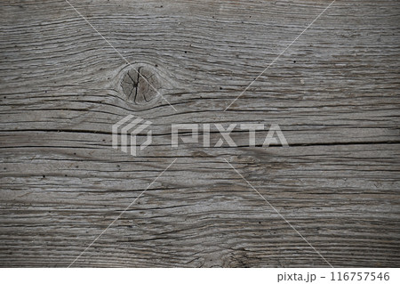 Weathered wooden surface with significant cracking and crevices 116757546