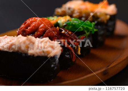 Gunkan maki sushi set on wooden plate, Japanese food 116757720