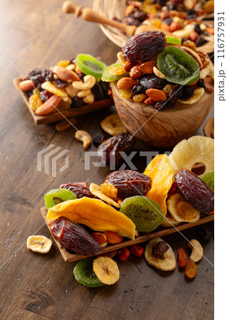 Dried tropical fruits with various nuts and raisins. 116757931