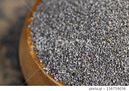 scattered poppy seeds for cooking 116759036