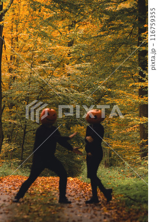 pregnant woman having with man having fun in halloween cost pregnant woman having with man having fun in halloween cost 116759355