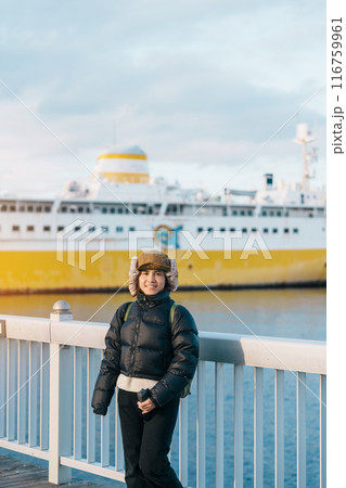Woman tourist sightseeing Aomori Bay Bridge area with the Hakkodamaru Memorial Ship, Traveler travel in Aomori city, Aomori Prefecture, Japan. Landmark for tourist attraction, travel and vacation Woman tourist sightseeing Aomori Bay Bridge area with the Hakkodamaru Memorial Ship, Traveler travel in Aomori city, Aomori Prefecture, Japan. Landmark for tourist attraction, travel and vacation 116759961