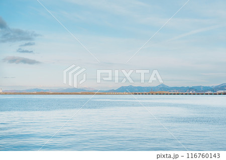 view of ocean and mountains with snow in winter at Aomori Bay Bridge Locate in the city of Aomori in Aomori Prefecture, Japan 116760143