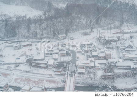 view of village with snow in winter from mountain viewpoint of Yamadera temple, the popular name for the Buddhist temple of Risshakuji located in Yamagata City, in Yamagata Prefecture, Tohuku, Japan 116760204