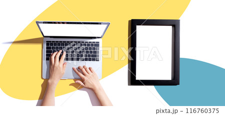 Laptop computer with a blank photo frame 116760375