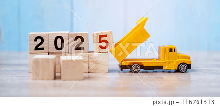 2025 Happy New year with miniature truck or construction vehicle. New Start, Vision, Resolution, goal, industrial, Warehouse concept 2025 Happy New year with miniature truck or construction vehicle. New Start, Vision, Resolution, goal, industrial, Warehouse concept 116761313