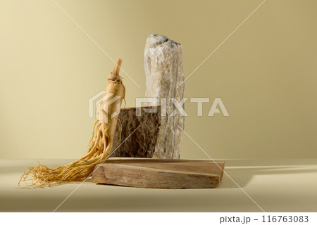 Frontal view photography for ginseng product advertising, against on light yellow background. An empty wooden pedestal displayed in the center of the table, in back of it is some rock Frontal view photography for ginseng product advertising, against on light yellow background. An empty wooden pedestal displayed in the center of the table, in back of it is some rock 116763083