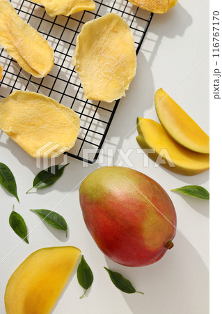 Dried mango chips with fresh sliced mango 116767170