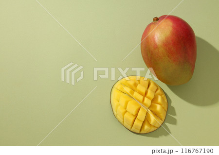 Ripe delicious mango on a light background Ripe delicious mango on a light background 116767190