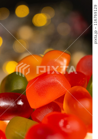 Christmas Gummy Colorful Candy on Garland Background. 116769129