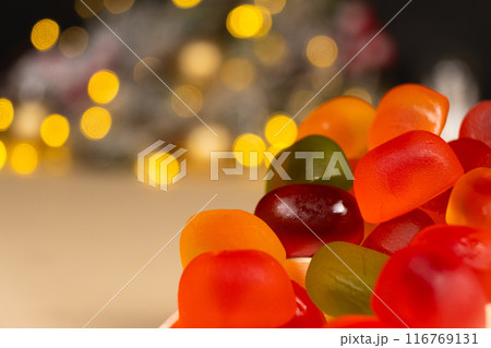 Christmas Gummy Colorful Candy on Garland Background. 116769131