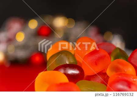 Christmas Gummy Colorful Candy on Garland Background. 116769132