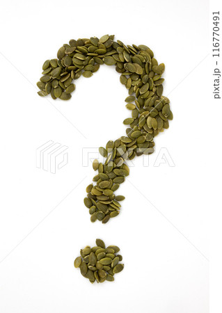 heap of green pumpkin seeds, close up 116770491
