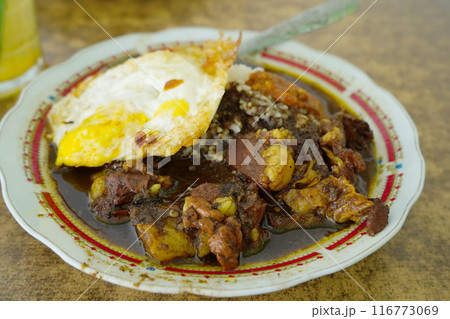 A vibrant plate of Nasi Rawon Campur. A vibrant plate of Nasi Rawon Campur. 116773069