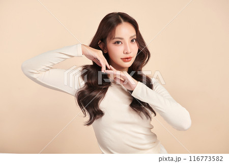 Beautiful young asian woman with clean fresh skin on beige background, Face care, Facial treatment, Cosmetology, beauty and spa, Asian women portrait. 116773582