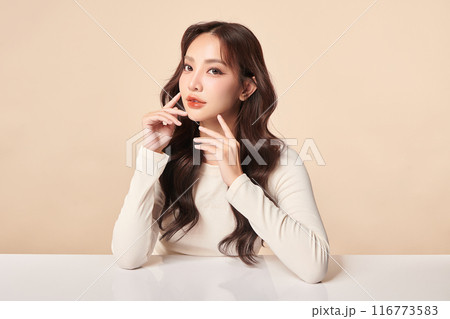 Beautiful young asian woman with clean fresh skin on beige background, Face care, Facial treatment, Cosmetology, beauty and spa, Asian women portrait. 116773583