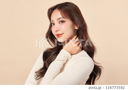 Beautiful young asian woman with clean fresh skin on beige background, Face care, Facial treatment, Cosmetology, beauty and spa, Asian women portrait. Beautiful young asian woman with clean fresh skin on beige background, Face care, Facial treatment, Cosmetology, beauty and spa, Asian women portrait. 116773592