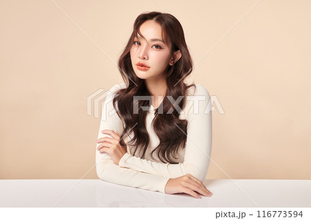 Beautiful young asian woman with clean fresh skin on beige background, Face care, Facial treatment, Cosmetology, beauty and spa, Asian women portrait. 116773594